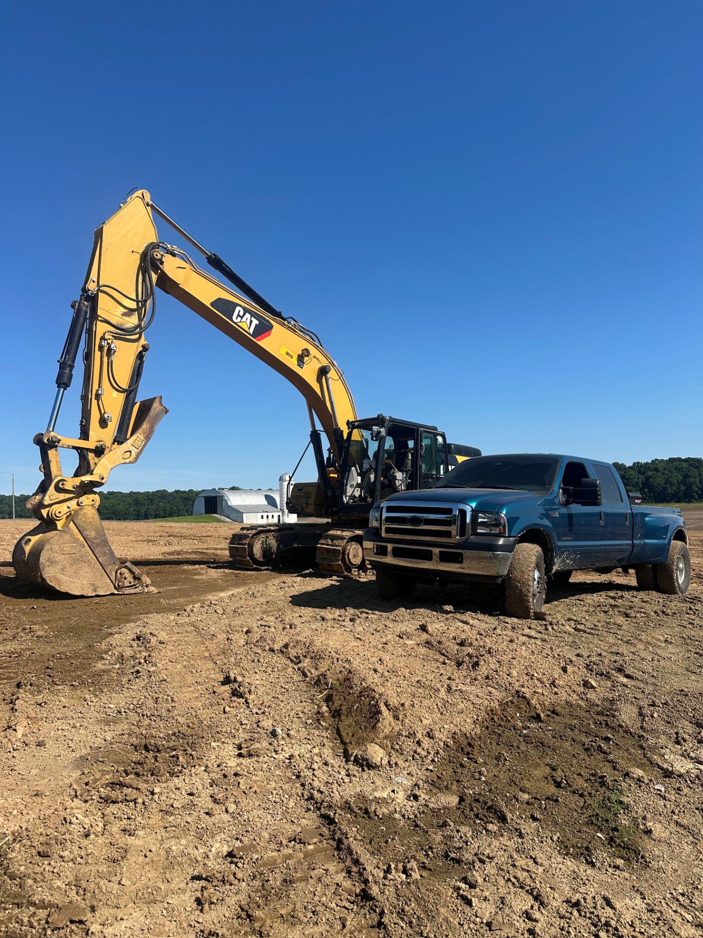 Compact excavator digging a foundation